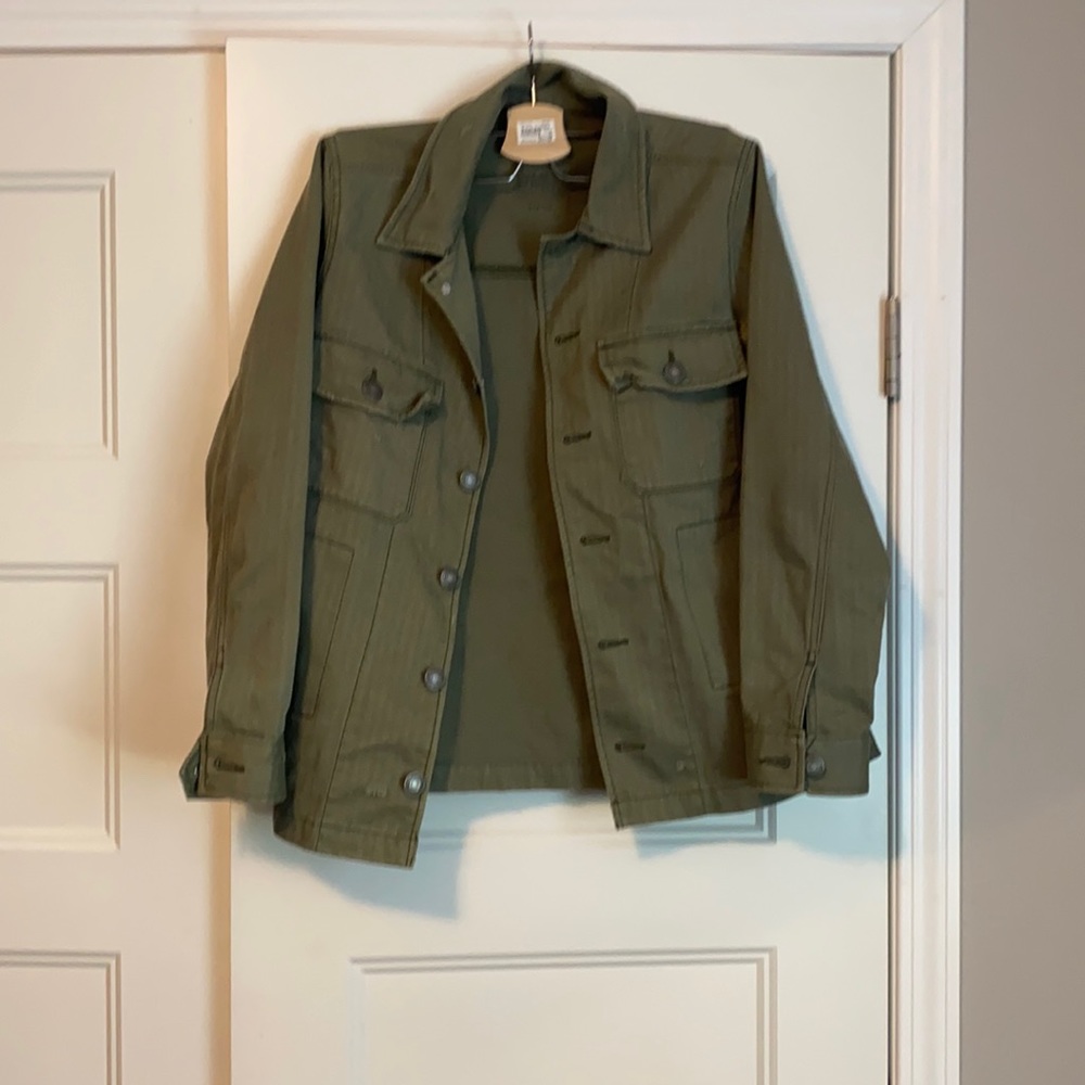 Army green jacket with some distressed markings